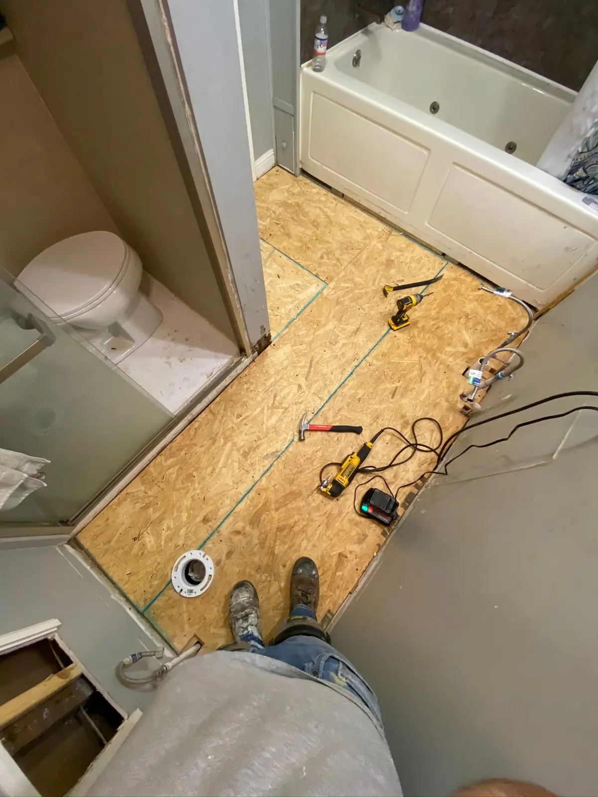 During work — Bathroom Tile and Laundry Plank Floors