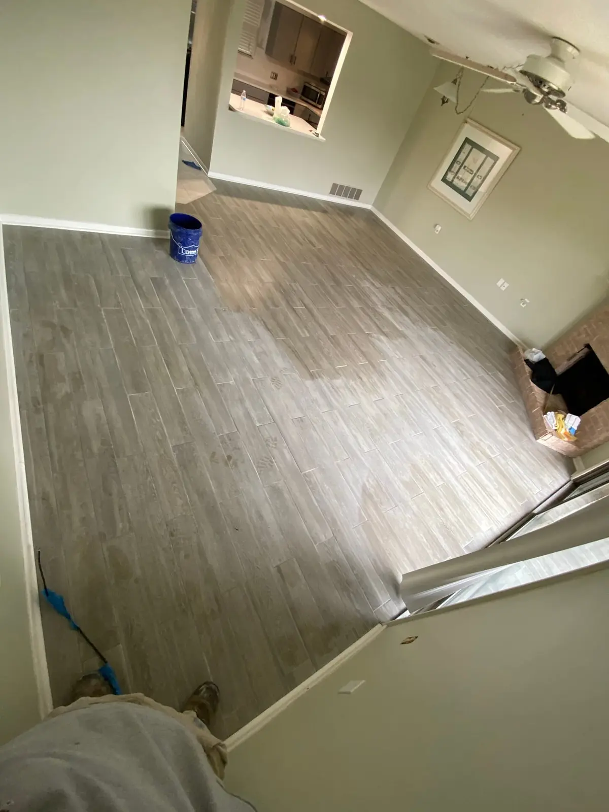 Living Room Wood-Look Floor with Brick Fireplace — finished photo 3