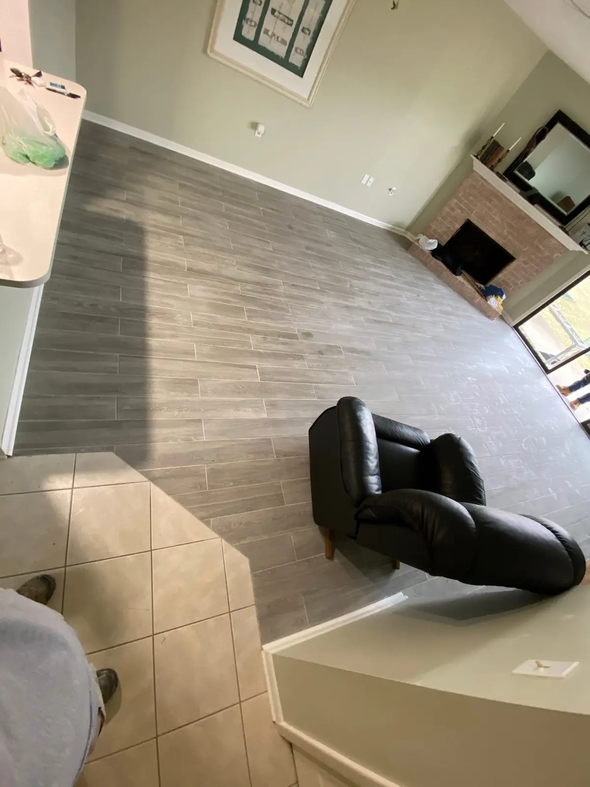 Living Room Wood-Look Floor with Brick Fireplace — finished photo 5