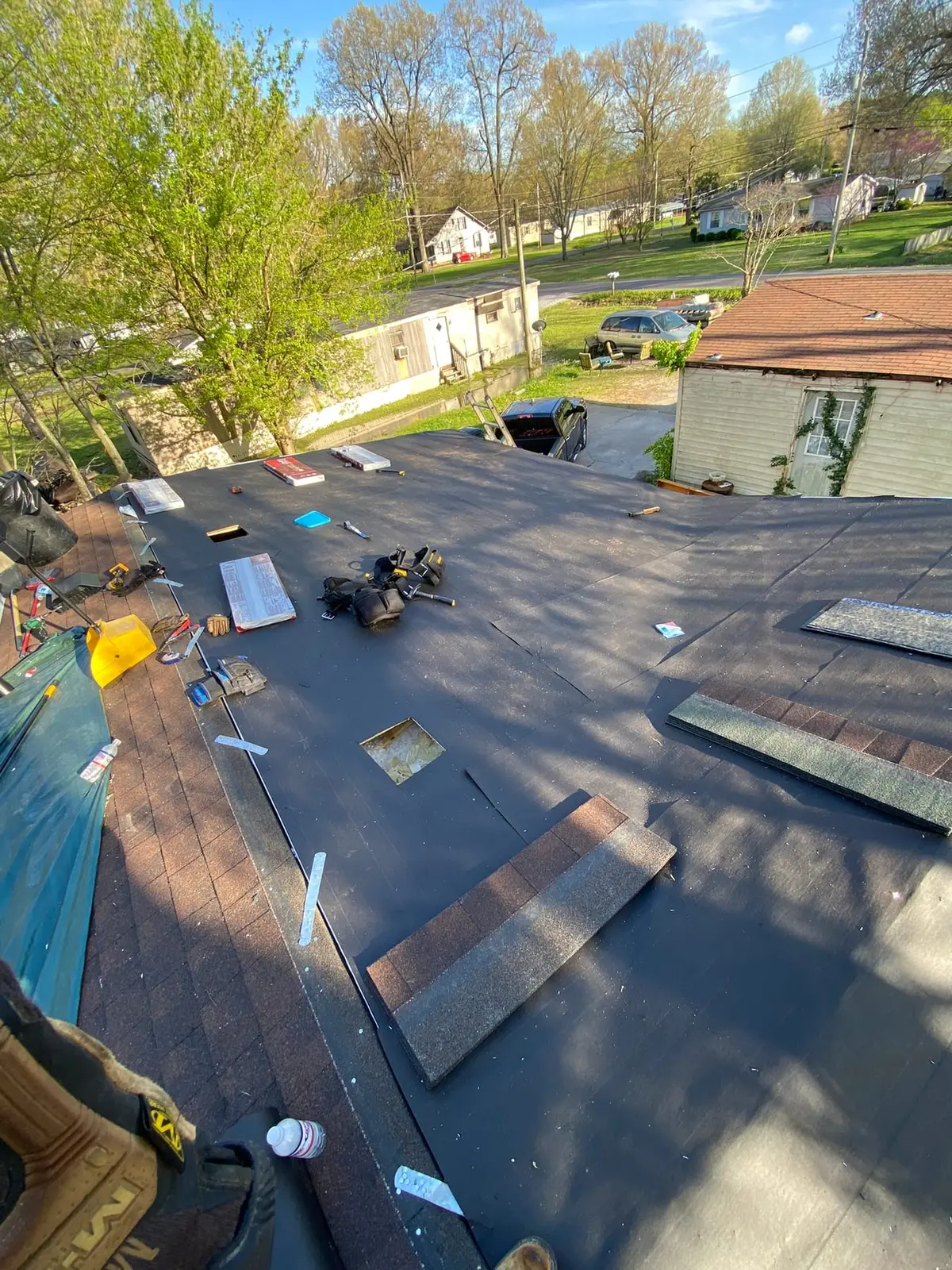 Tree-fall roof rebuild during roof decking and shingle installation