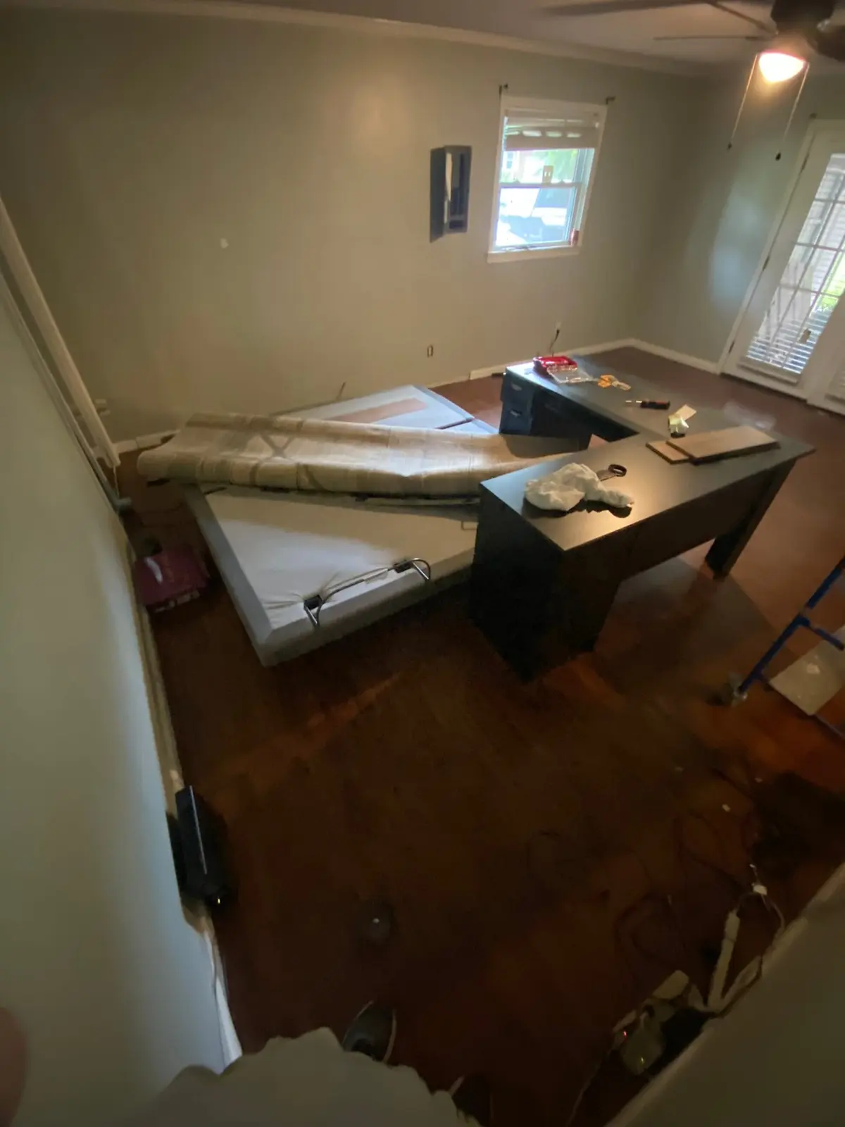 Charcoal Bedroom with New Plank Floor — Before photo 1