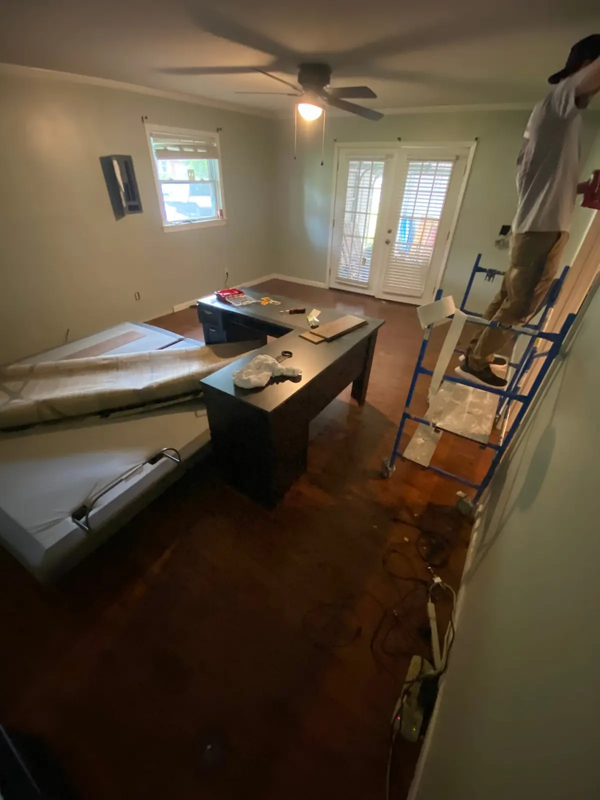 Charcoal Bedroom with New Plank Floor — Before photo 2