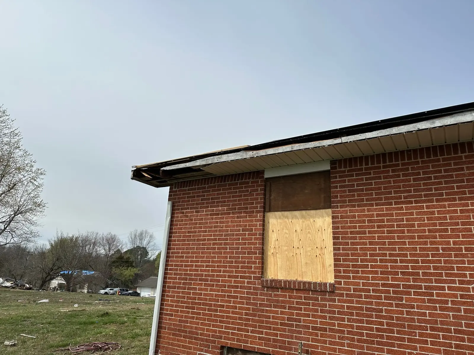 Storm-Damaged Brick Ranch Rebuilt with New Addition — Before photo 1
