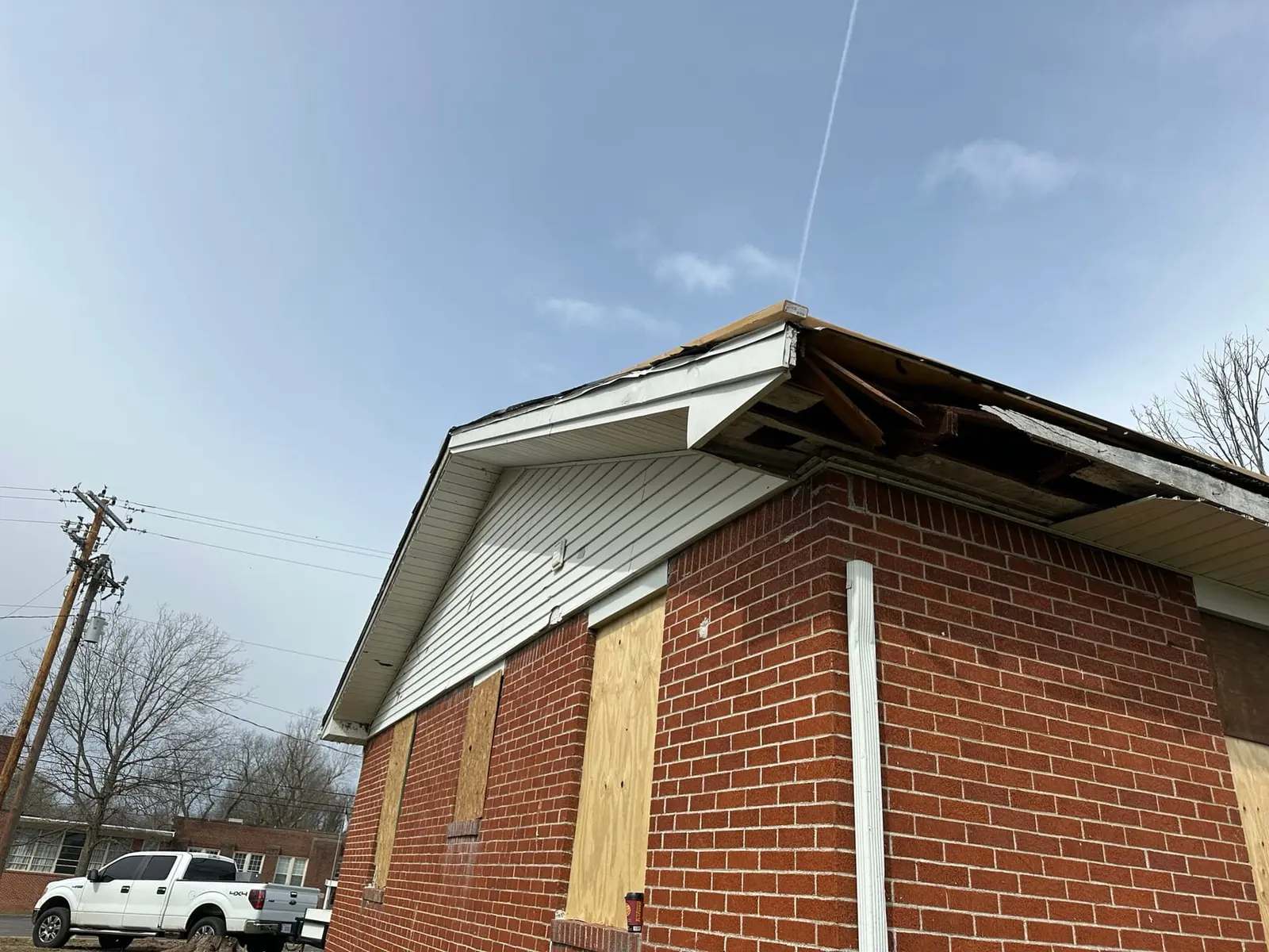 Storm-Damaged Brick Ranch Rebuilt with New Addition — Before photo 2