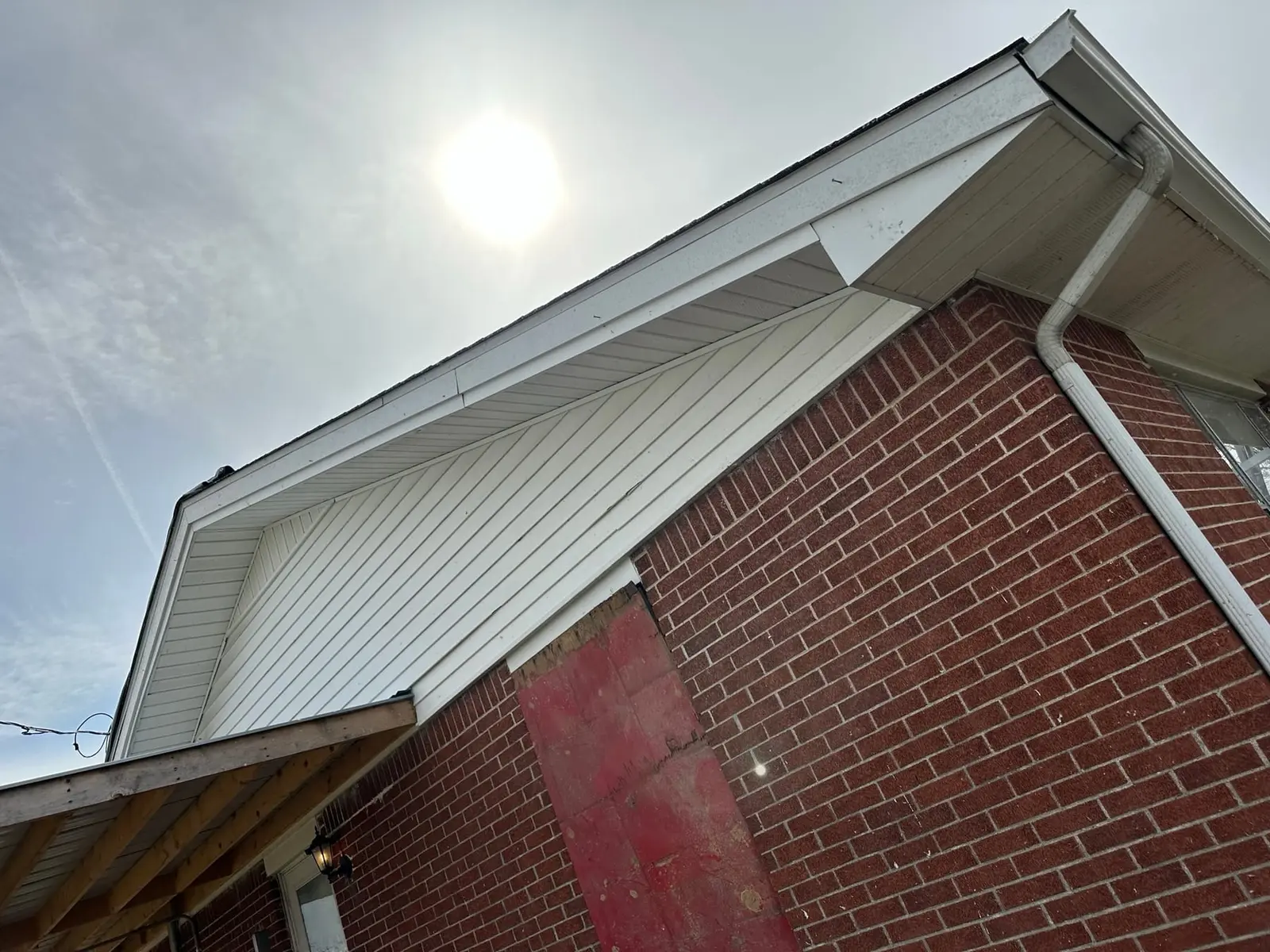 Storm-Damaged Brick Ranch Rebuilt with New Addition — Before photo 3