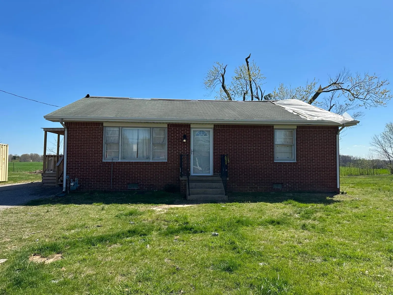 Storm-Damaged Brick Ranch Rebuilt with New Addition — Before photo 12