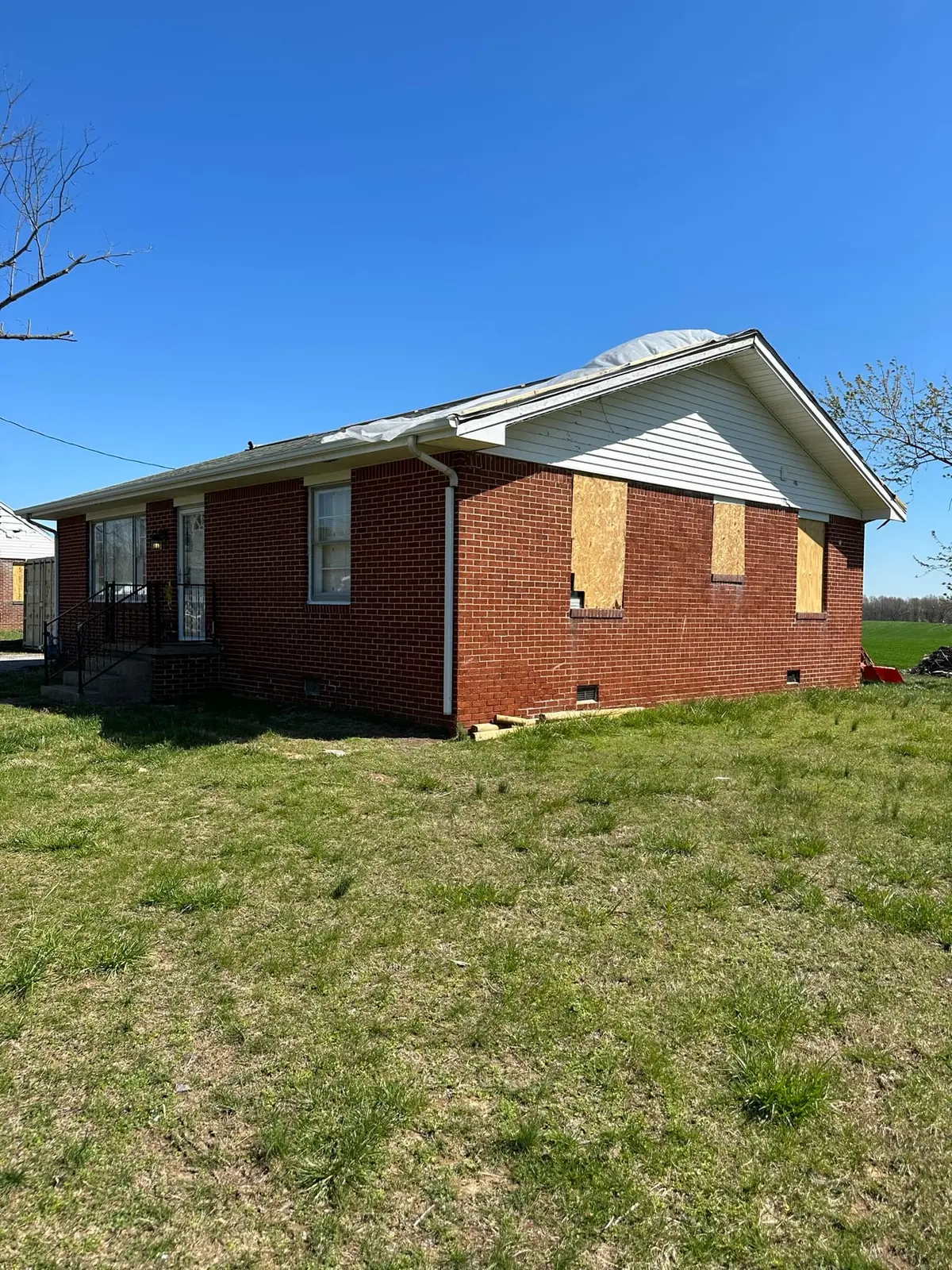 Storm-Damaged Brick Ranch Rebuilt with New Addition — Before photo 13