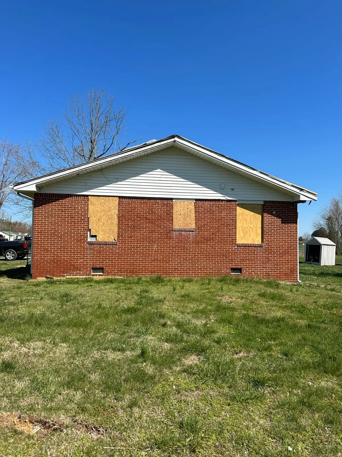 Storm-Damaged Brick Ranch Rebuilt with New Addition — Before photo 16