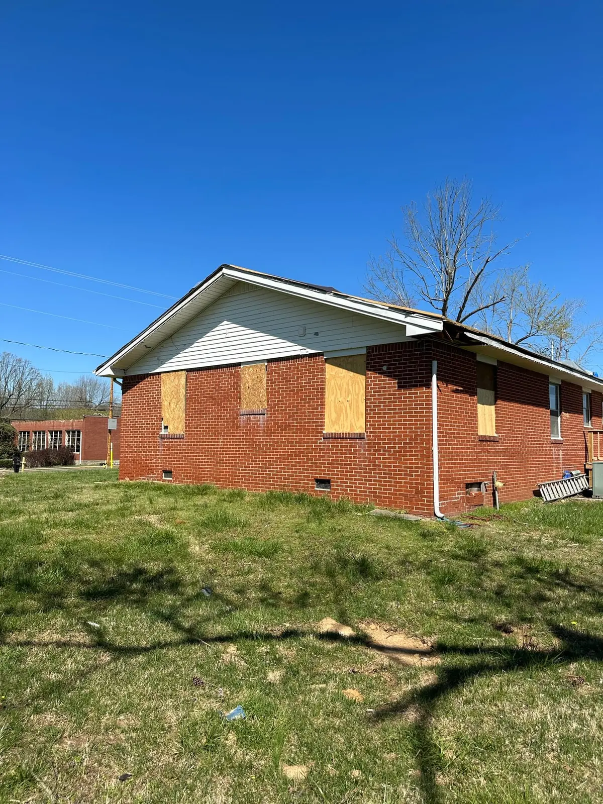 Storm-Damaged Brick Ranch Rebuilt with New Addition — Before photo 17