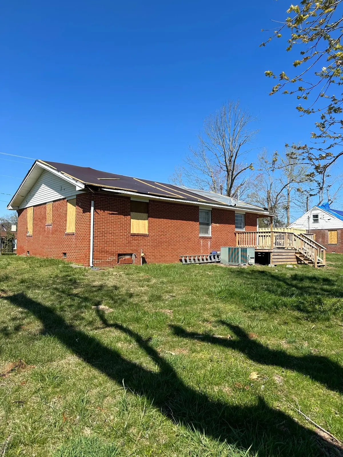 Before — Storm-Damaged Brick Ranch Rebuilt with New Addition