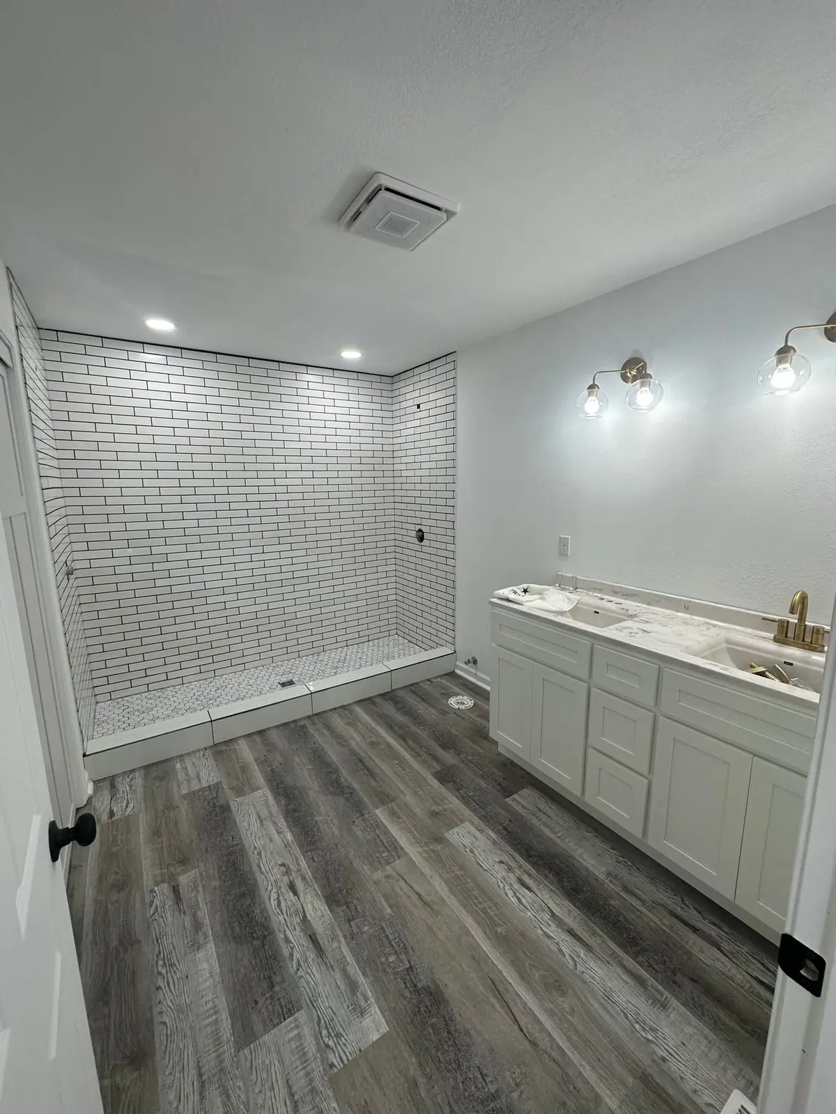 Storm-Damaged Brick Ranch Rebuilt with New Addition — finished photo 39