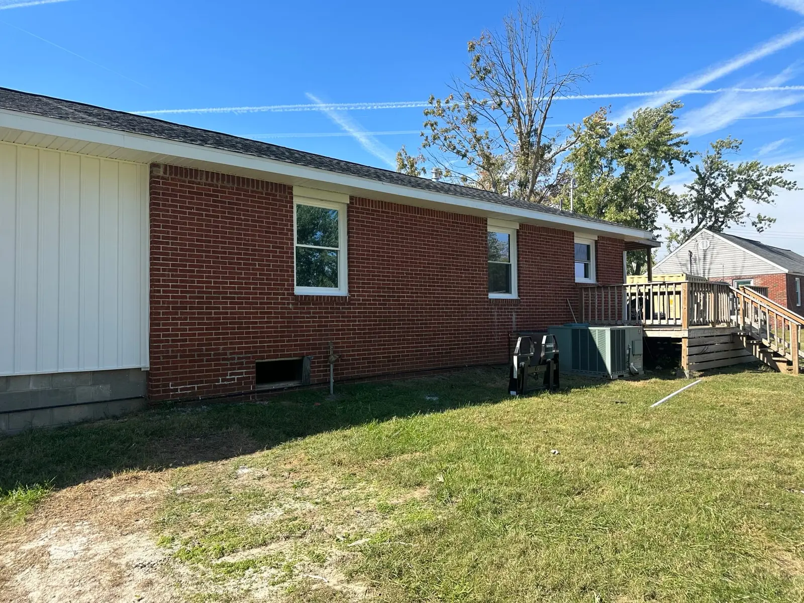 Storm-Damaged Brick Ranch Rebuilt with New Addition — finished photo 2