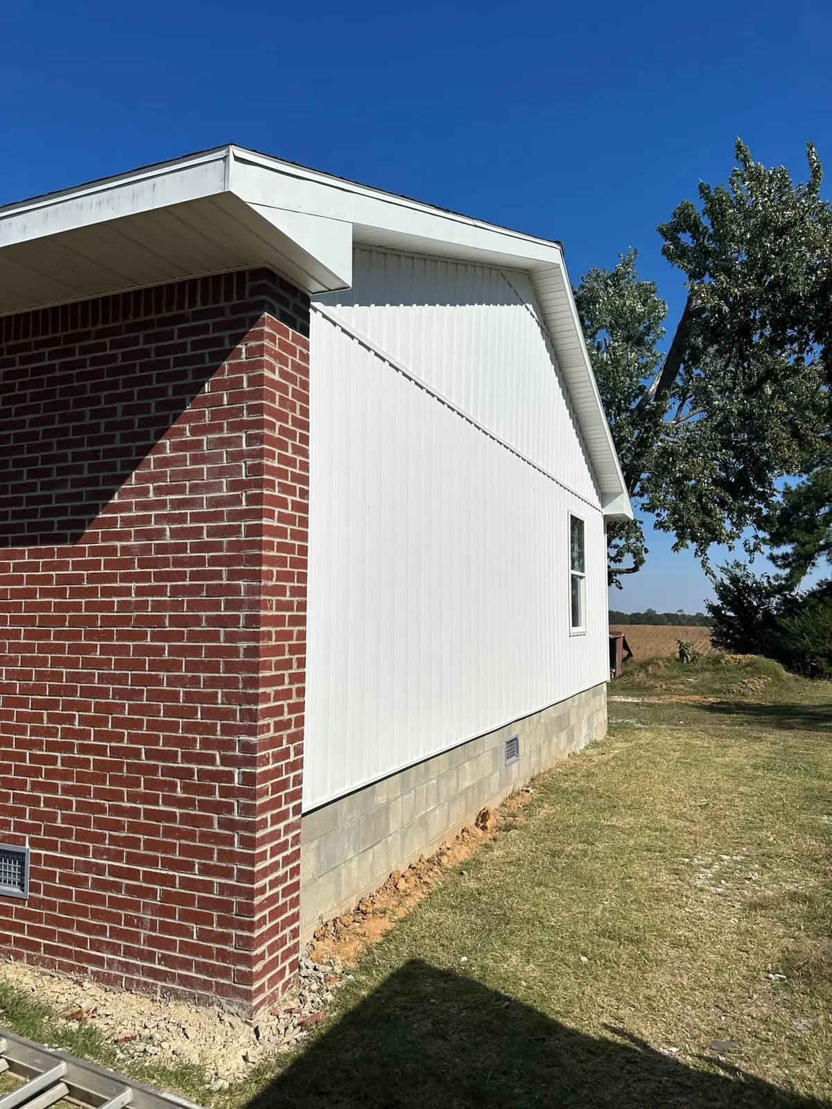 Storm-Damaged Brick Ranch Rebuilt with New Addition — finished photo 44