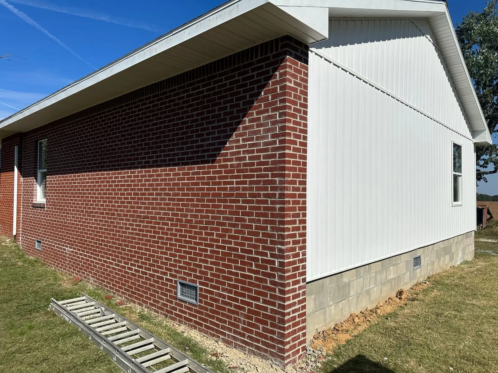 Storm-Damaged Brick Ranch Rebuilt with New Addition — finished photo 45