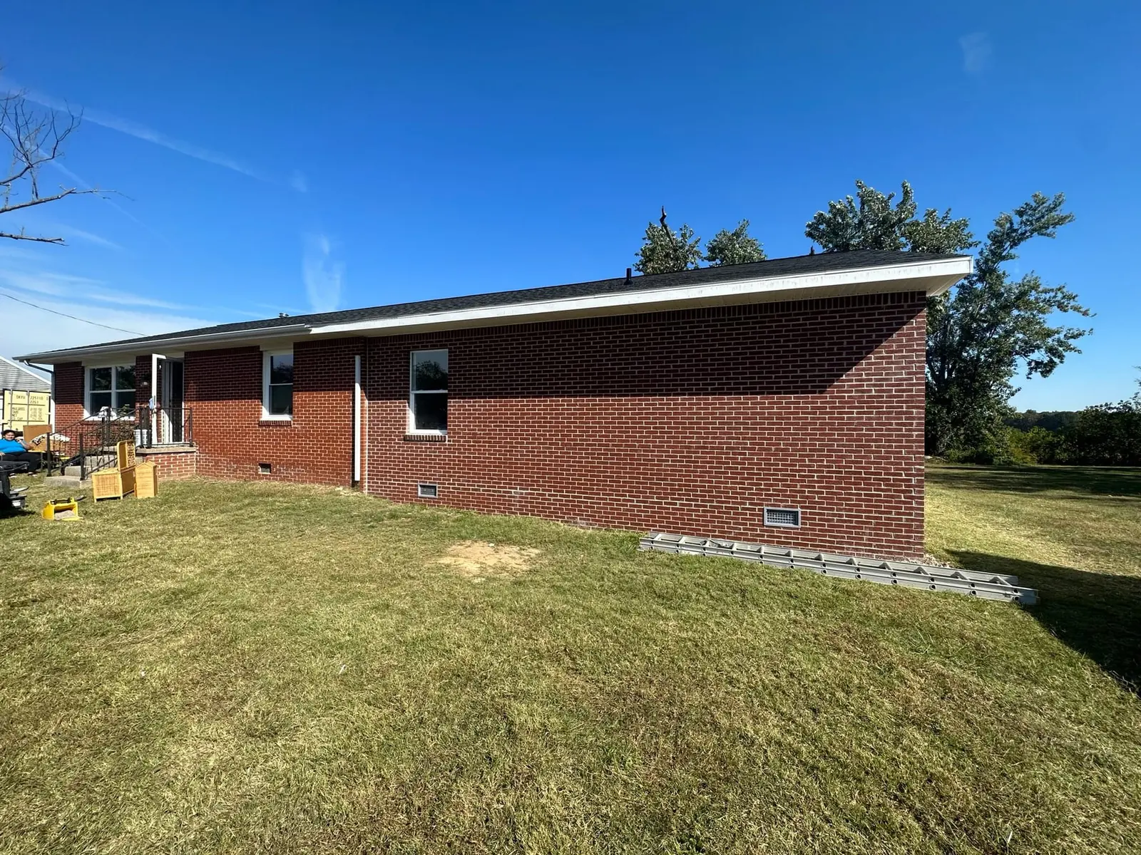 Storm-Damaged Brick Ranch Rebuilt with New Addition — finished photo 46