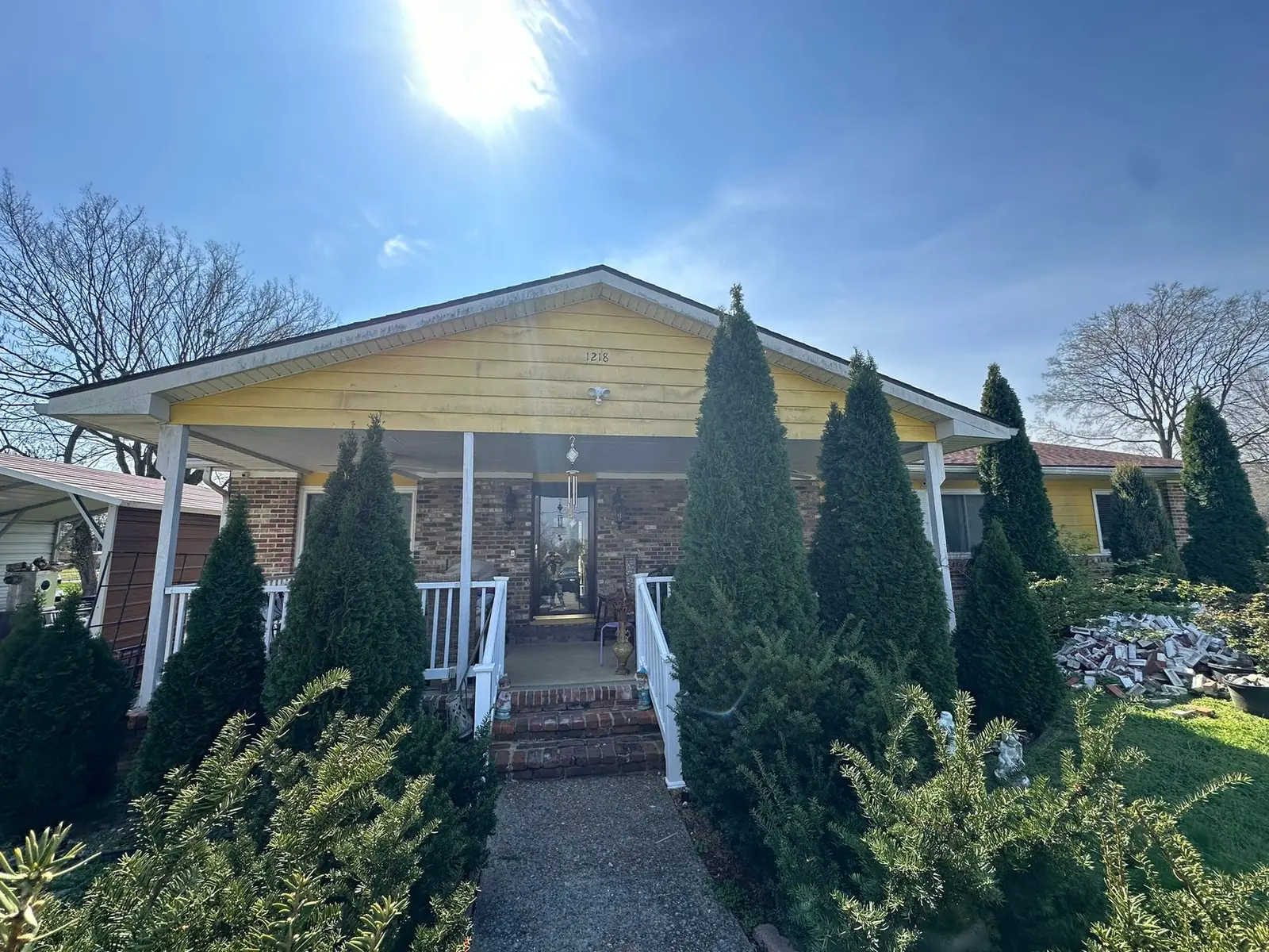Before — Yellow Ranch House Re-Sided in Navy Blue