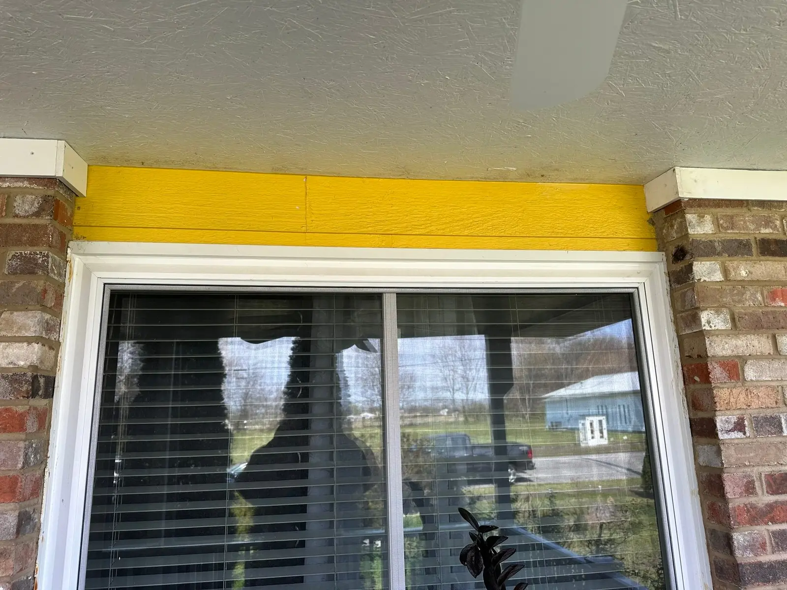 Yellow Ranch House Re-Sided in Navy Blue — Before photo 5