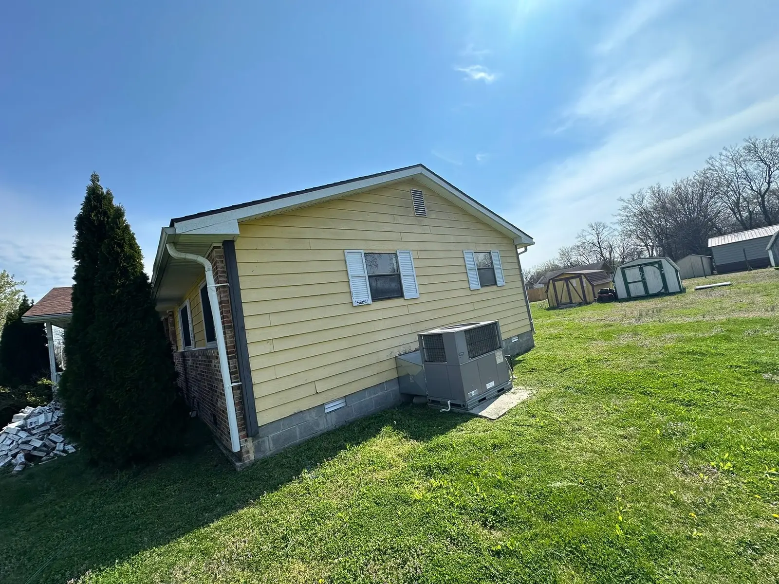 Yellow Ranch House Re-Sided in Navy Blue — Before photo 7