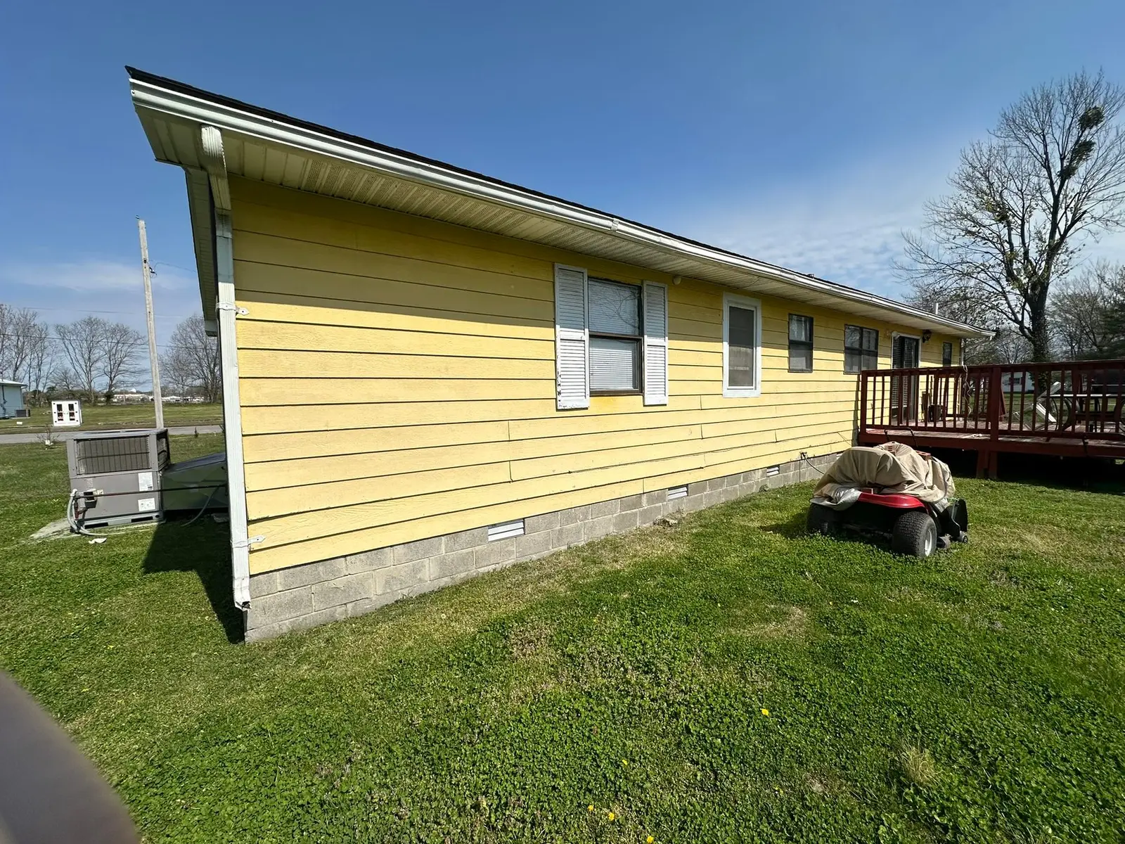 Yellow Ranch House Re-Sided in Navy Blue — Before photo 9