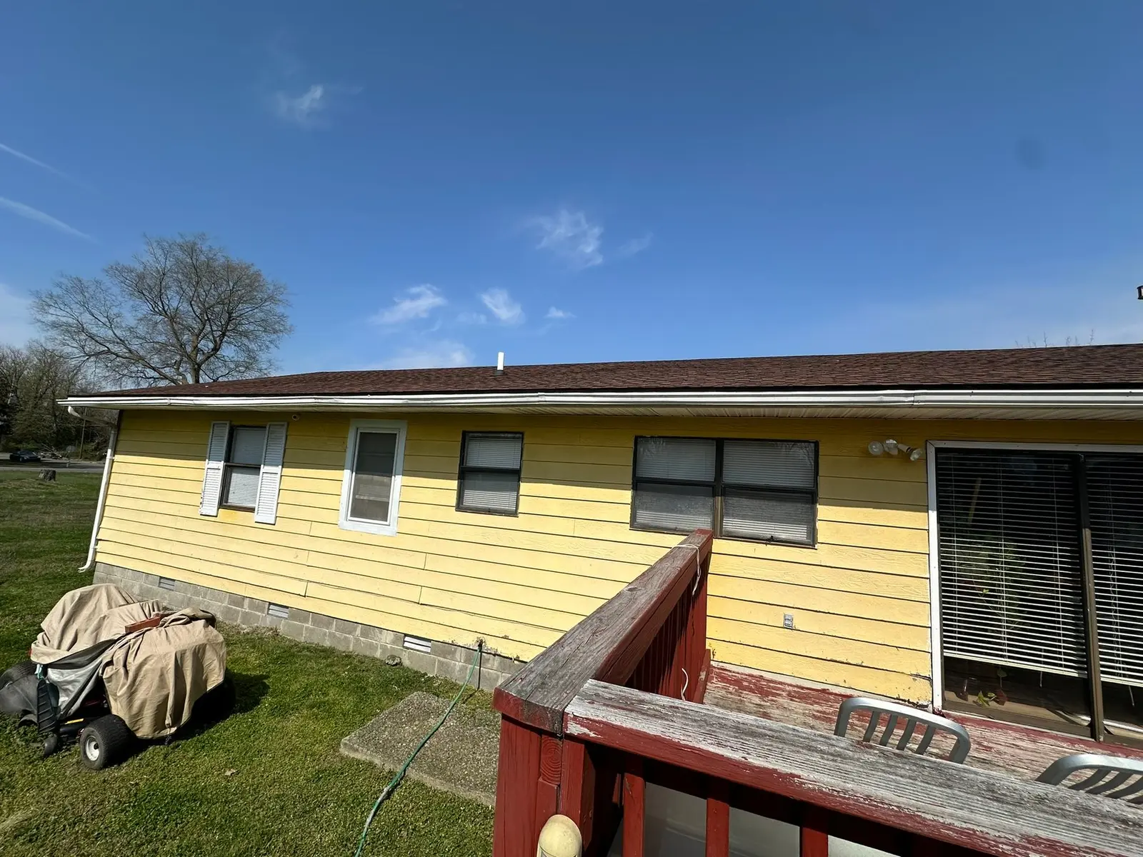 Yellow Ranch House Re-Sided in Navy Blue — Before photo 10
