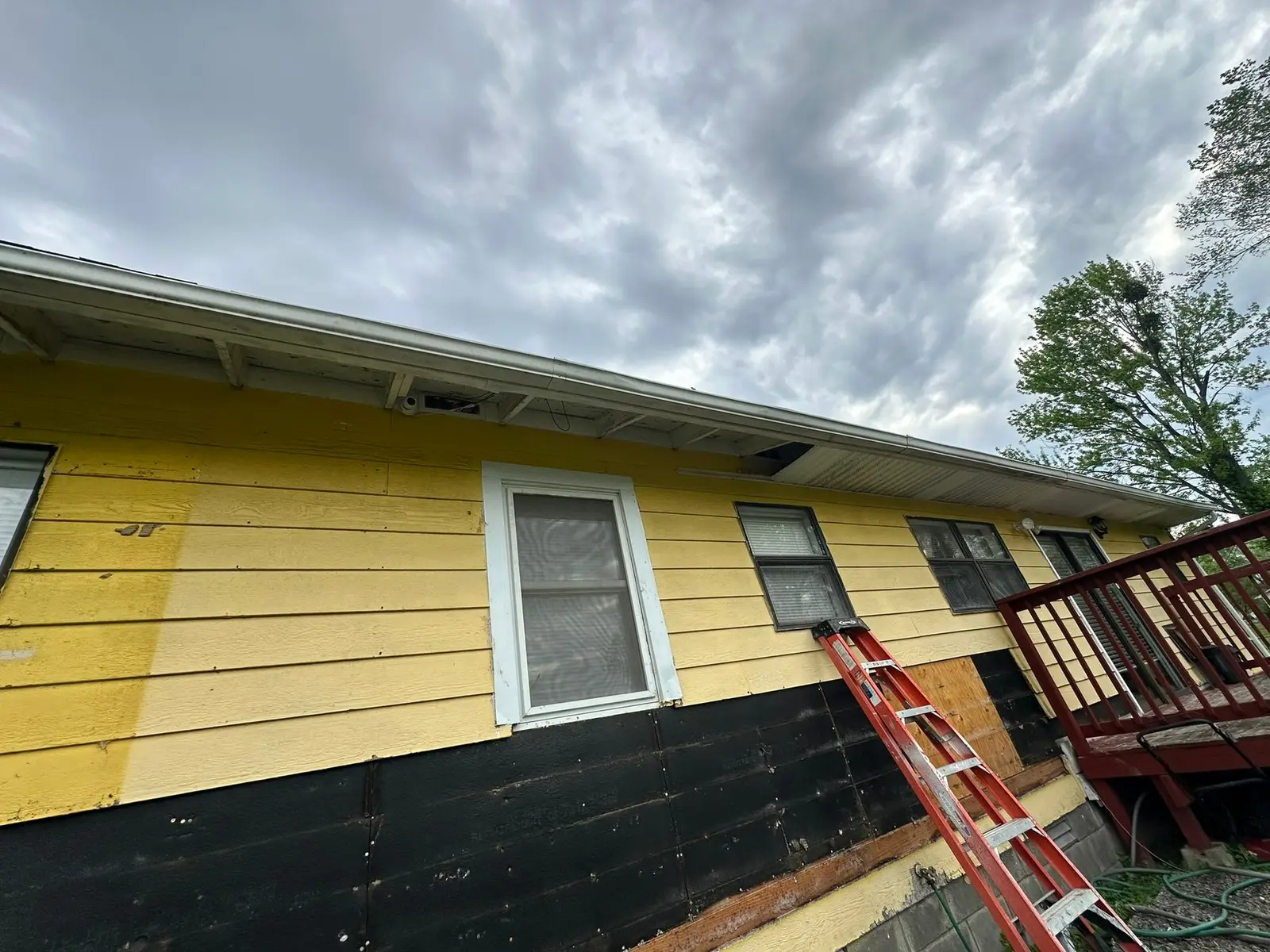 Yellow Ranch House Re-Sided in Navy Blue — Progress photo 3