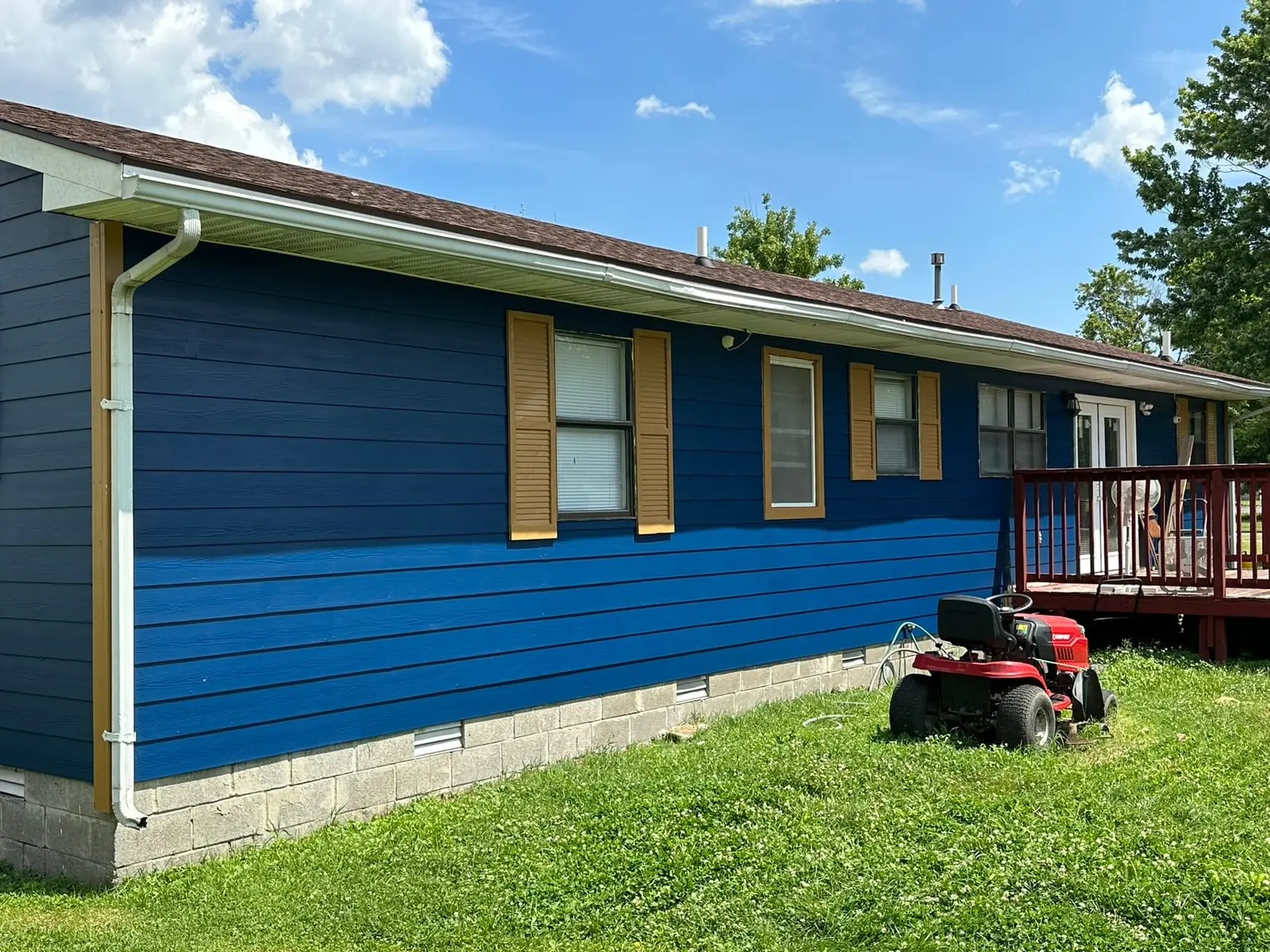 Yellow Ranch House Re-Sided in Navy Blue