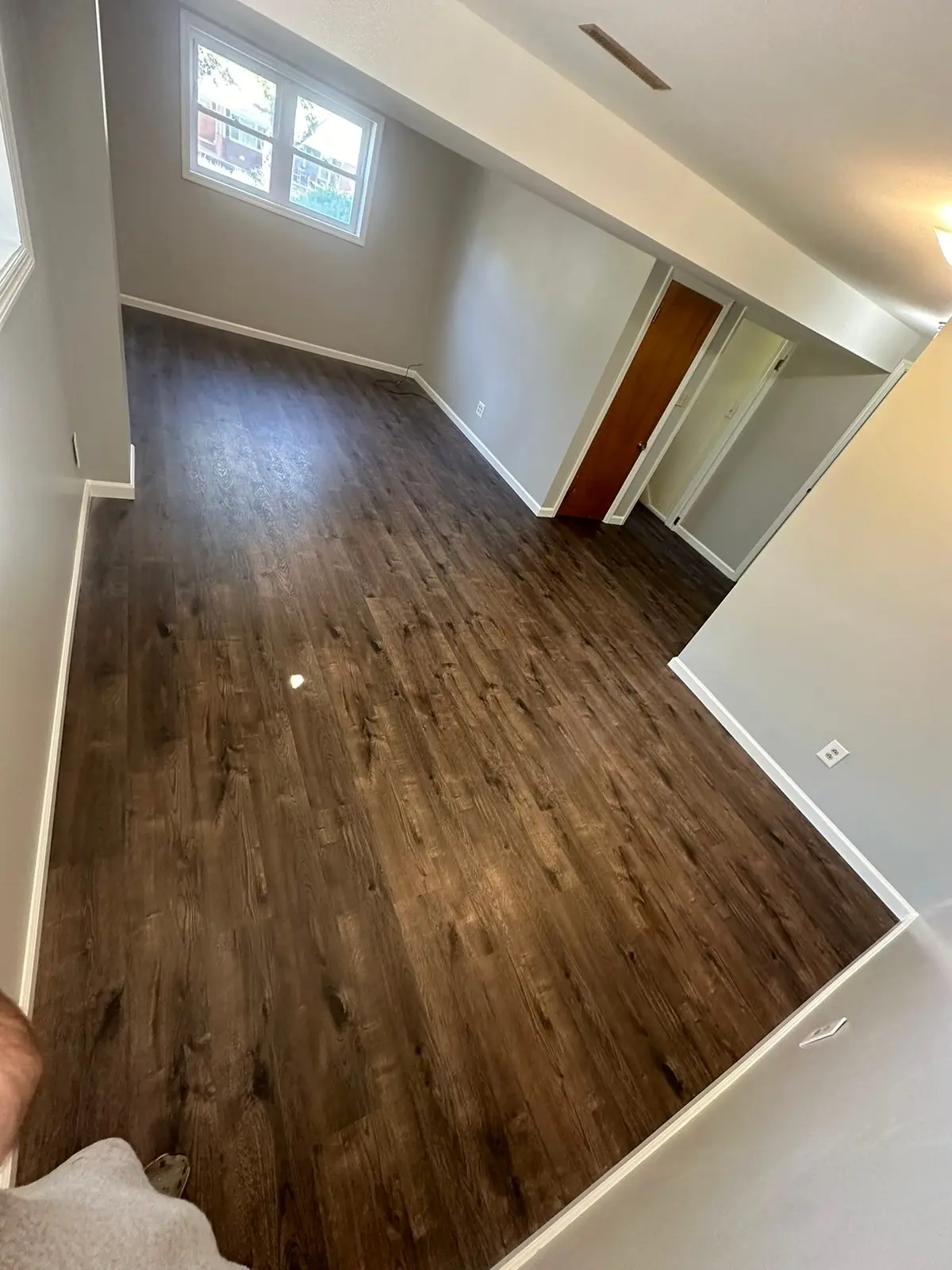 Lower-Level Remodel, Paneling to Drywall with New Floor
