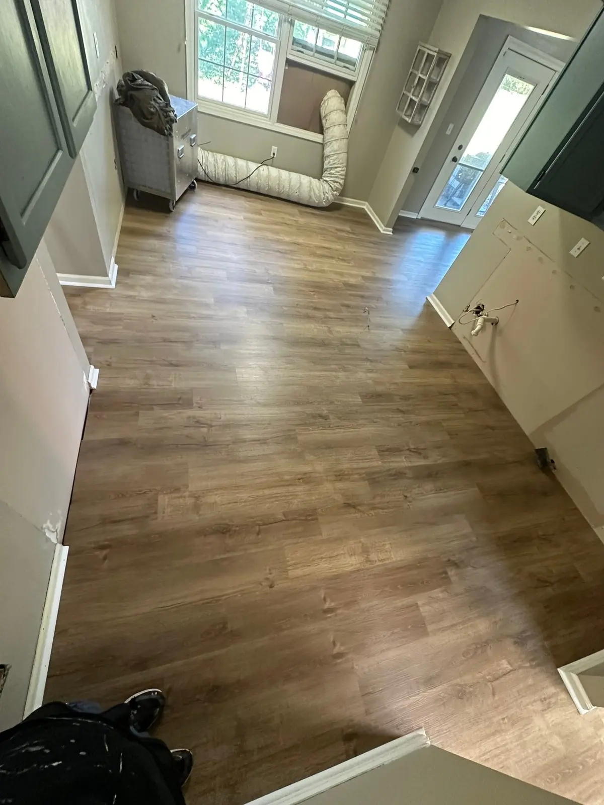 Whole-House Floor Tear-Out, New Subfloor and Wood-Look Plank — finished photo 4