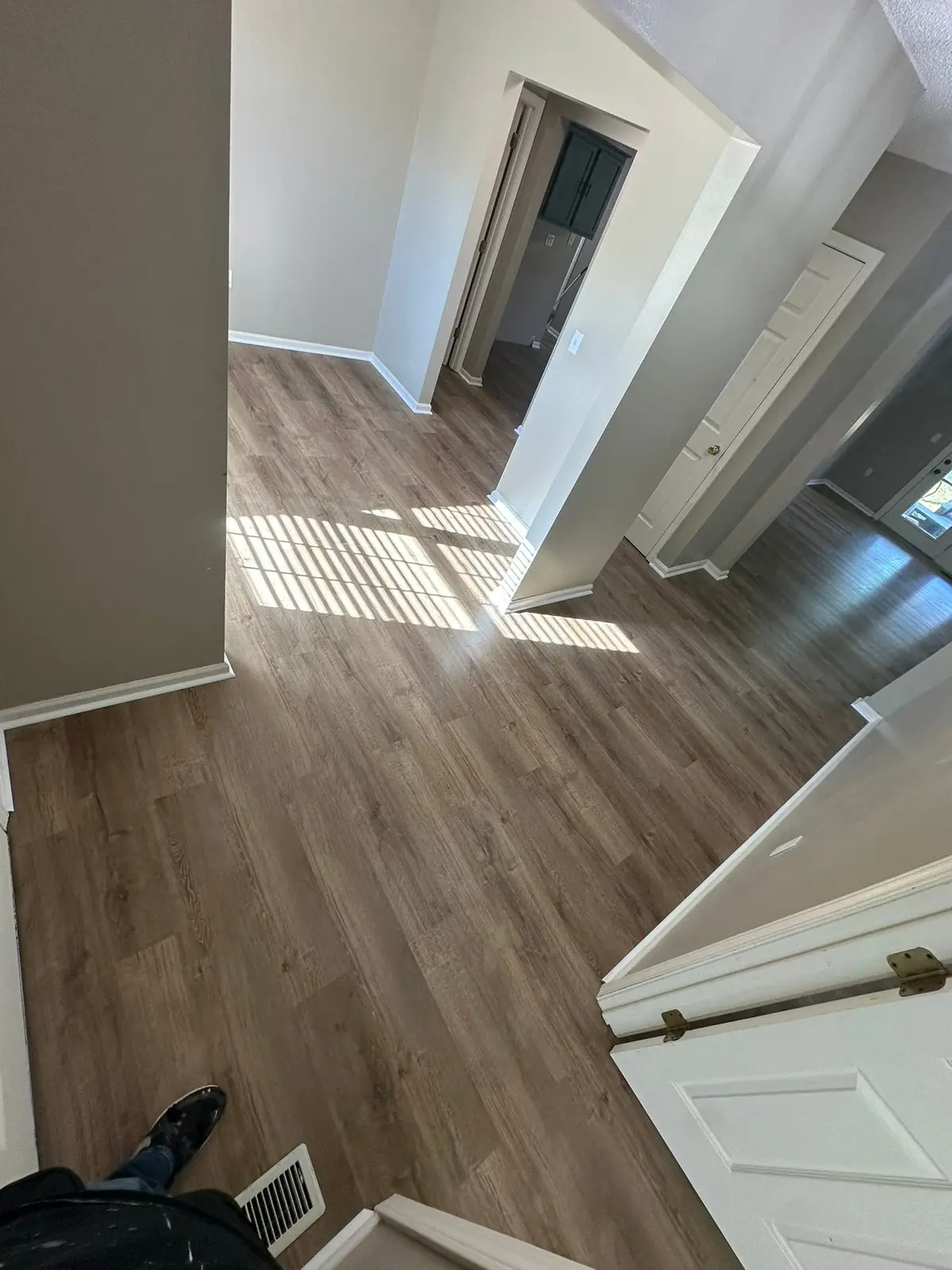 Whole-House Floor Tear-Out, New Subfloor and Wood-Look Plank — finished photo 7