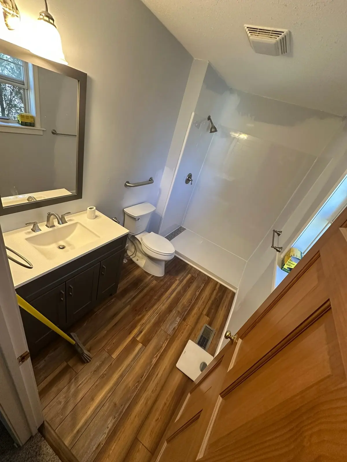 Bathroom with Grab Bars and Plank Floor — finished photo 2