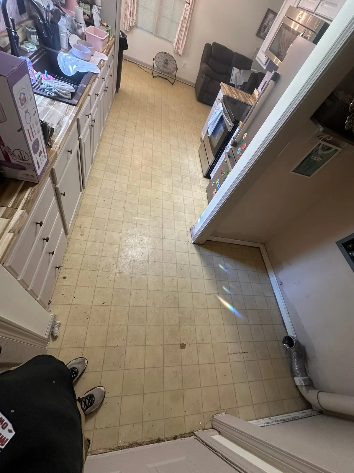 Before — Dark Wood-Look Plank Through Main Living Areas
