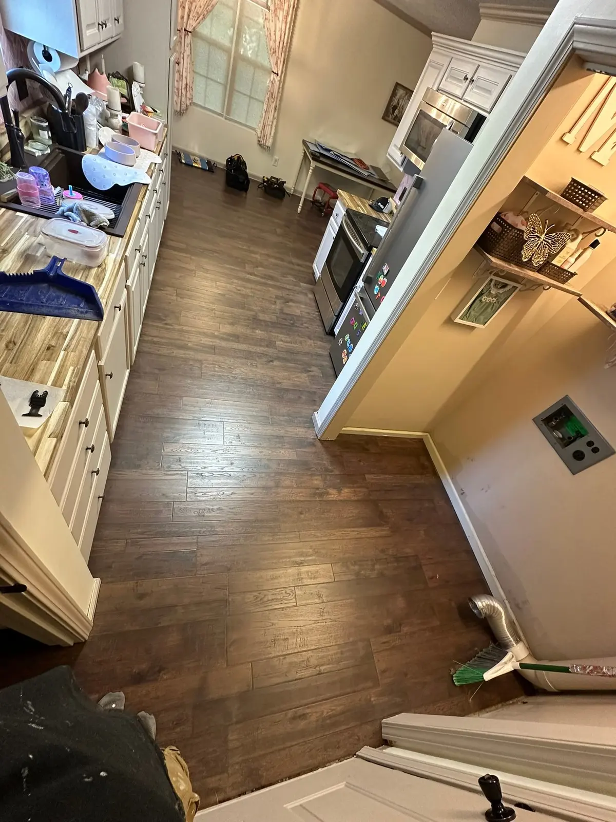Dark Wood-Look Plank Through Main Living Areas — finished photo 2