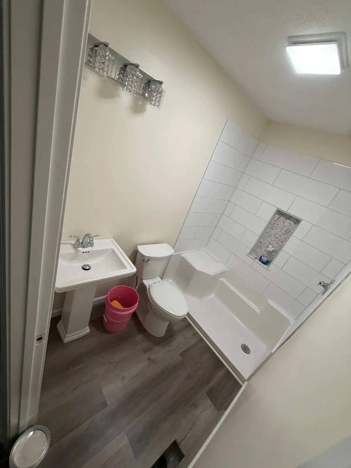 Tiled Shower with Seat and New Plank Floor — finished photo 4