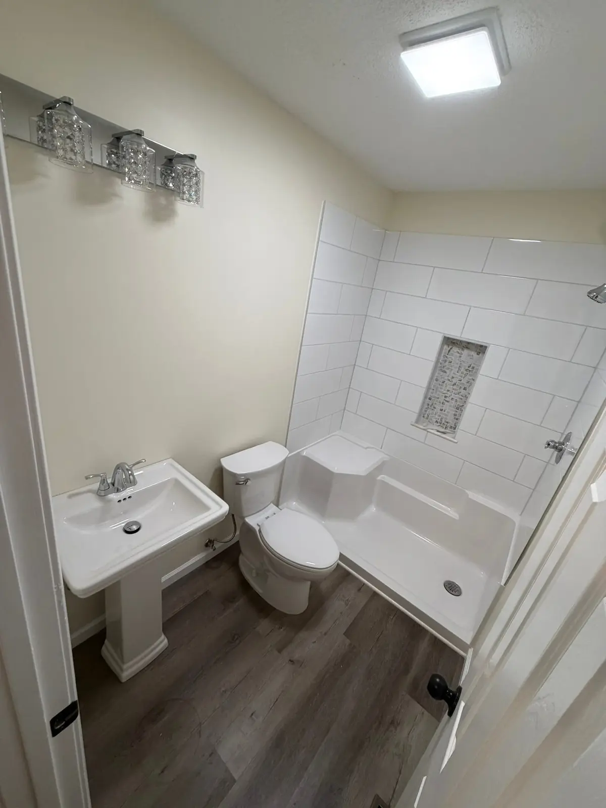 Tiled Shower with Seat and New Plank Floor — finished photo 8