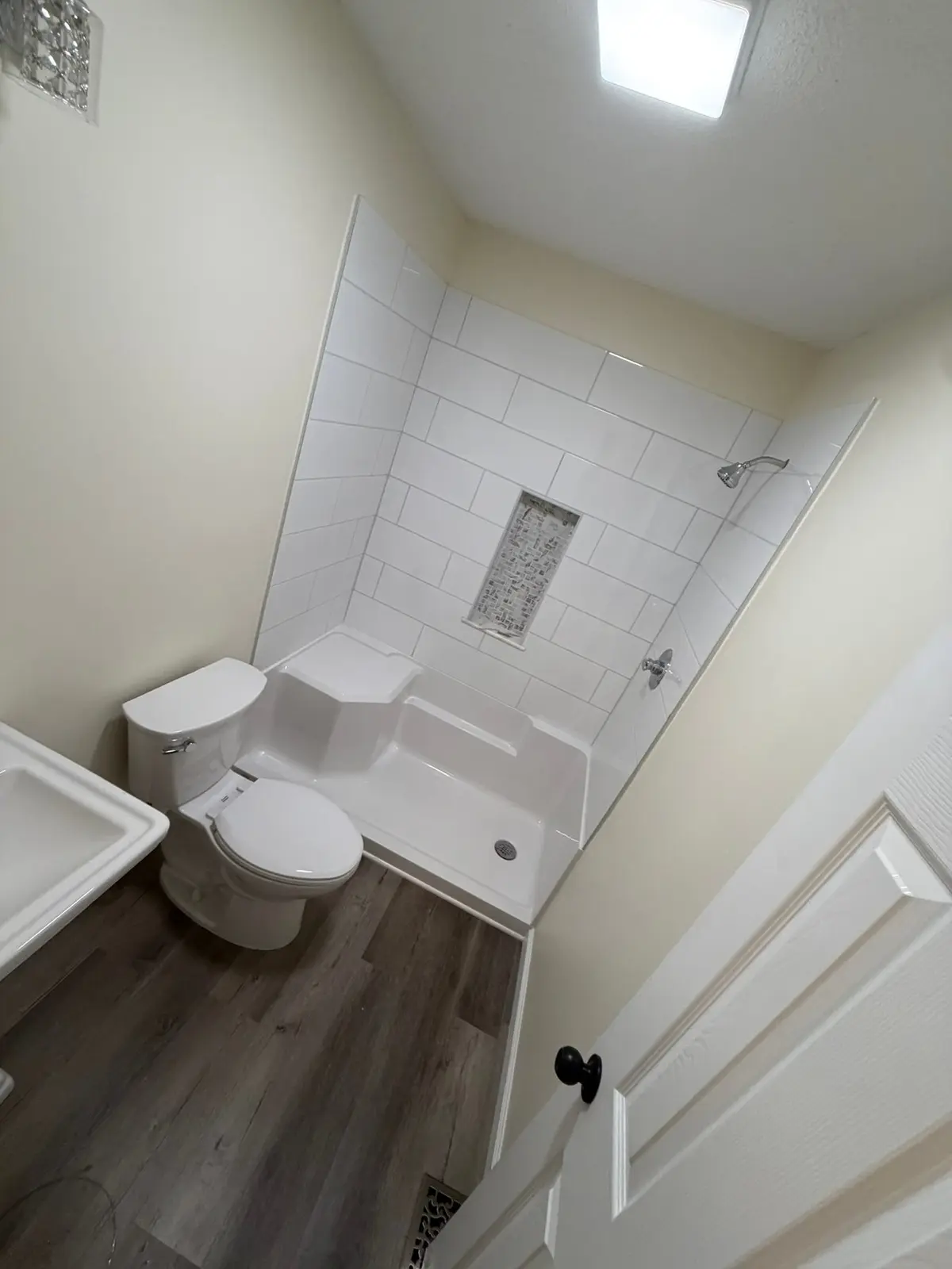 Tiled Shower with Seat and New Plank Floor — finished photo 6